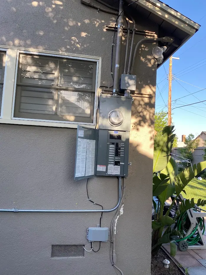 BlueWest Electric main panel upgrade with meter and conduit on a home exterior