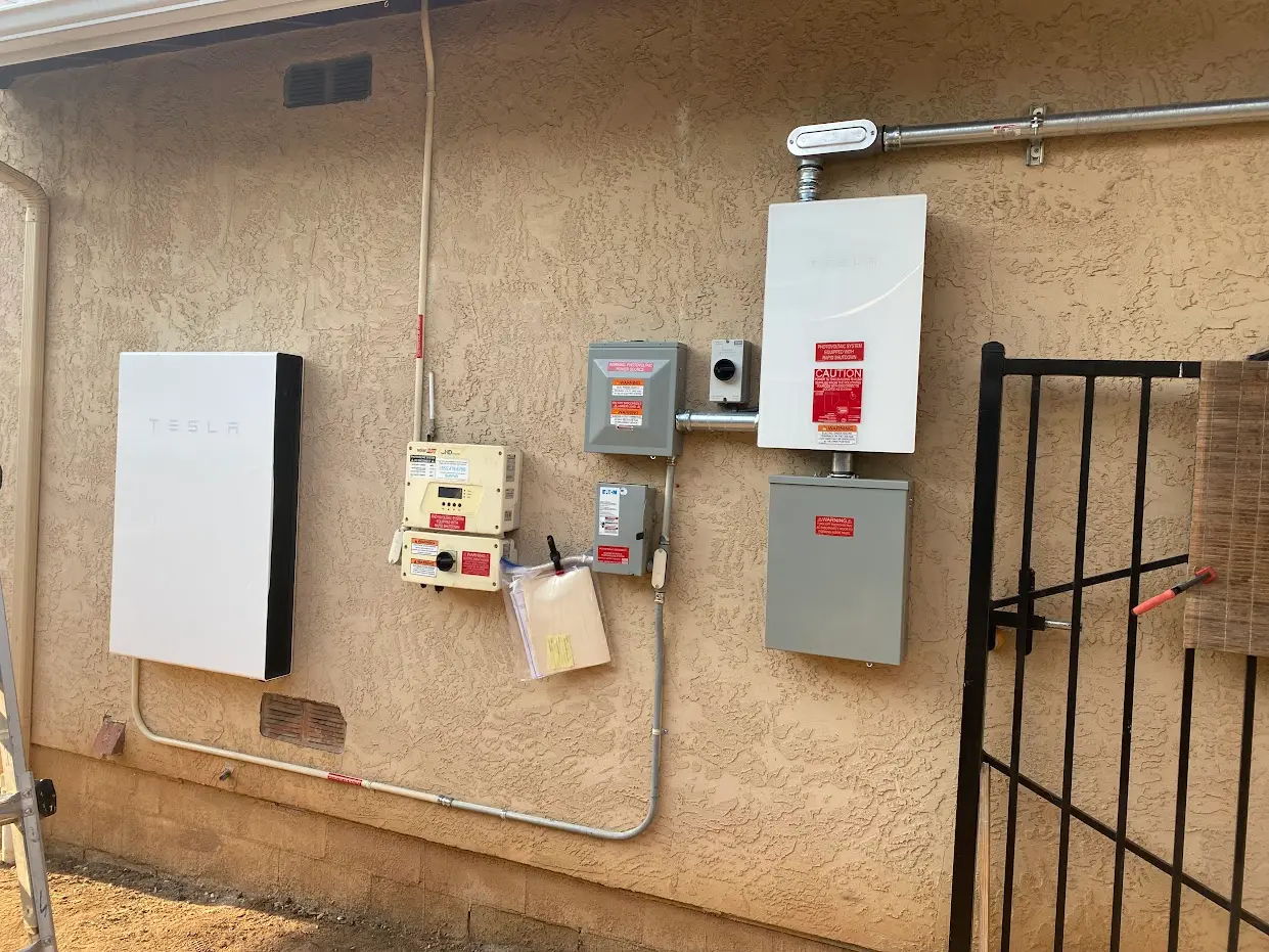 BlueWest Electric Tesla Powerwall and Gateway installation on a stucco wall